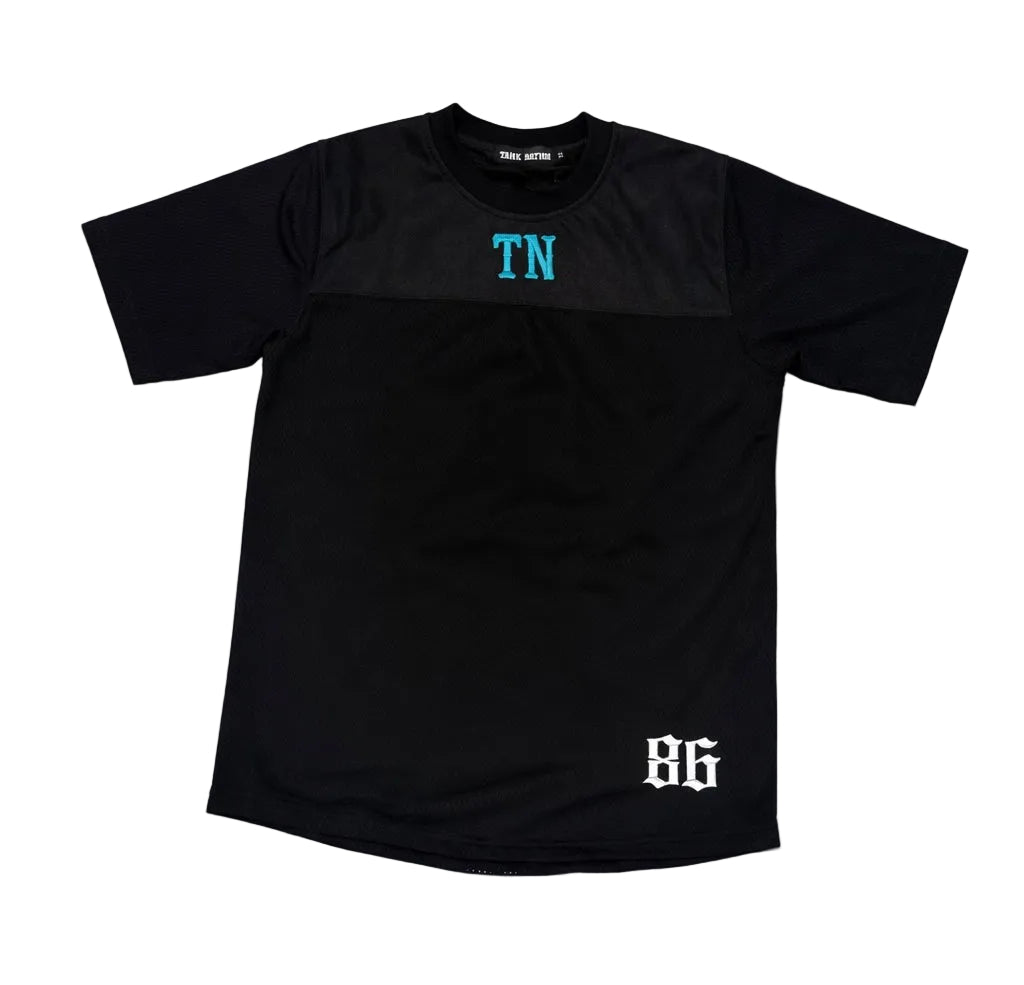 Black t-shirt with 'TN' and '86' text on a gray background